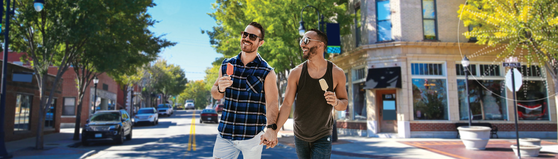 two men smiling and walking with ice cream