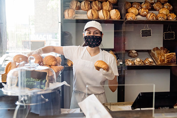 female salesperson at a bakery