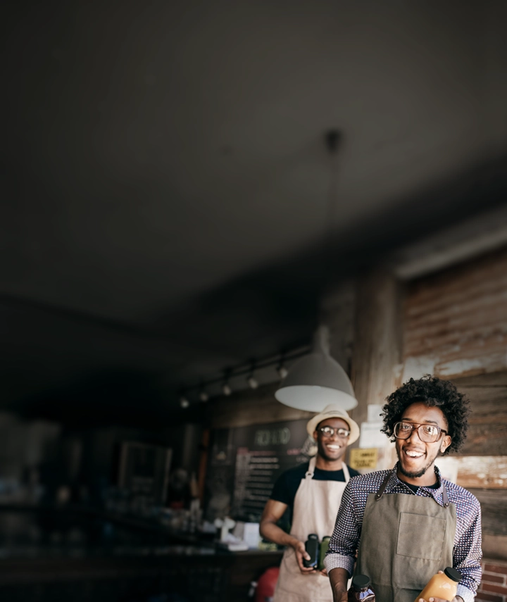A man wearing an apron and smiling